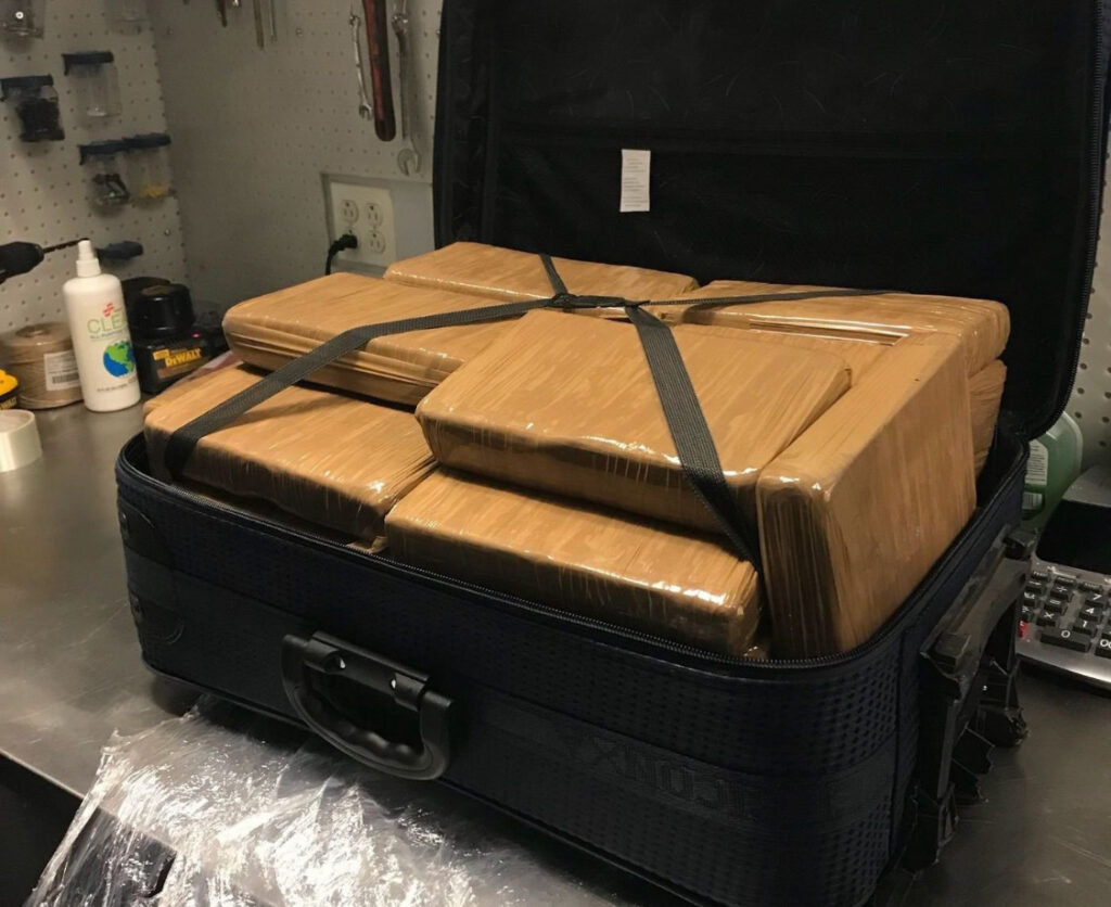 buying cocaine online Canada, this is a photo powder cocaine well parceled in brown papers full in a suitcase