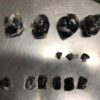 buy black tar heroin online. this is a photo of black tar heroin rapped in small plastics like balls on a silver tray