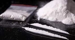 buy bolivian cocaine online, this is a photo of cocaine from Bolivia on a table with some already put in a medical plastic for shipping